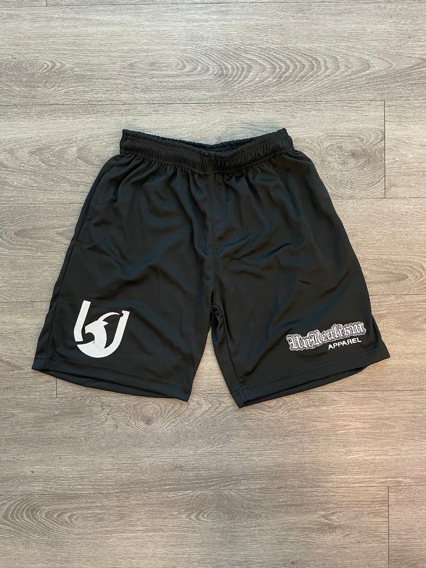 "UNREALISM" TECH SHORTS (Unisex)